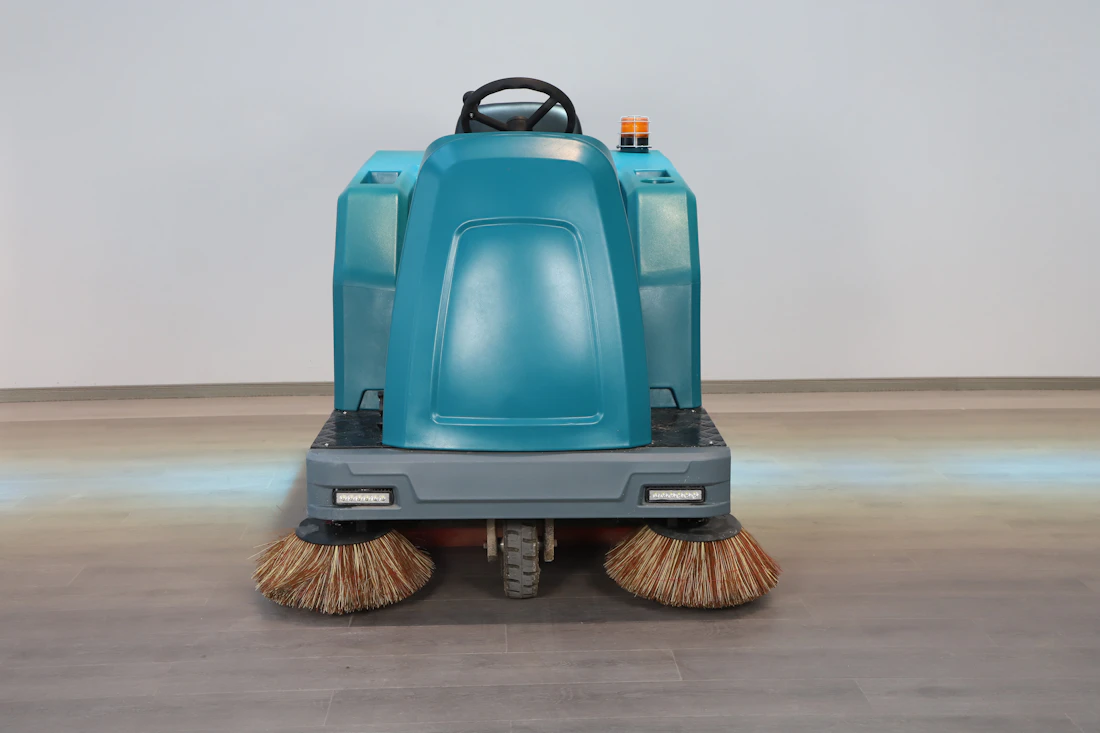 Commercial floor scrubber machine maintaining polished flooring